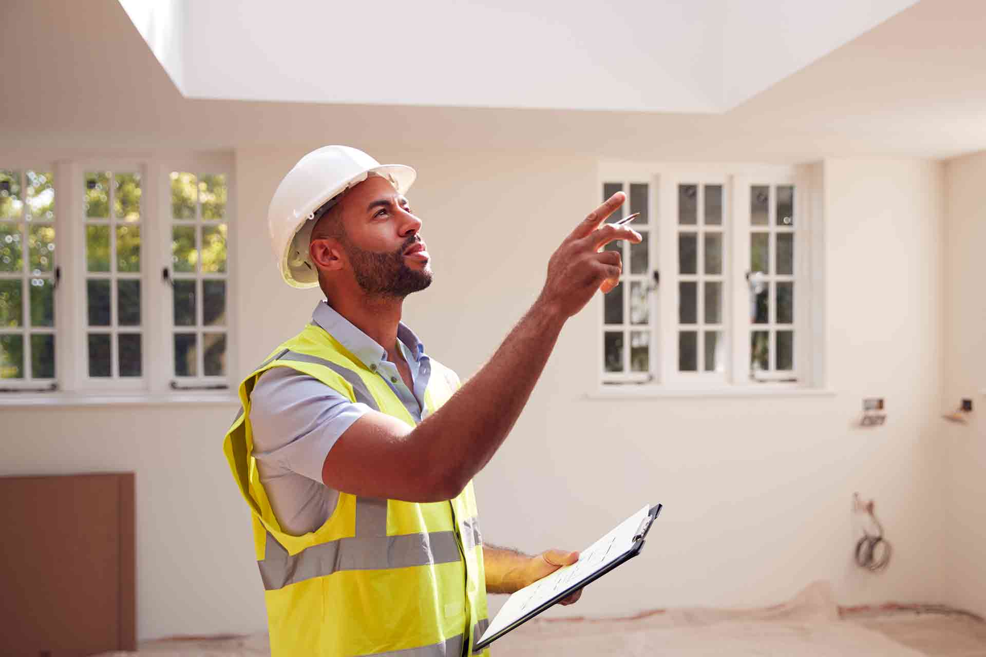 Third Party Wall Surveyors Bristol reviewing plans between two parties during a dispute